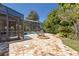 Well-manicured backyard features a screened-in pool and mature landscaping at 1912 Westover Reserve Blvd, Windermere, FL 34786