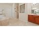 Well-appointed bathroom featuring soaking tub, glass enclosed shower, and wood vanity at 1912 Westover Reserve Blvd, Windermere, FL 34786