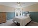 Cozy bedroom with two-tone paint, natural light, and a wardrobe at 1912 Westover Reserve Blvd, Windermere, FL 34786