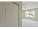 Bright bedroom boasts a window and sliding door closet at 1912 Westover Reserve Blvd, Windermere, FL 34786