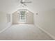 Spacious bonus room with vaulted ceiling and a large window at 1912 Westover Reserve Blvd, Windermere, FL 34786