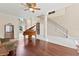 Spacious foyer with a grand staircase, piano, and high ceilings at 1912 Westover Reserve Blvd, Windermere, FL 34786
