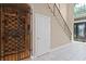 Elegant foyer featuring a wine cellar, staircase with iron railings, and tiled floors at 1912 Westover Reserve Blvd, Windermere, FL 34786