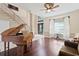 Grand foyer showcasing a piano, staircase, and elegant tile flooring at 1912 Westover Reserve Blvd, Windermere, FL 34786