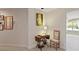 Hallway featuring a sewing table and chair leading to a bright room at 1912 Westover Reserve Blvd, Windermere, FL 34786