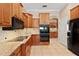 Stylish kitchen with granite counters, stainless appliances, and wood cabinetry at 1912 Westover Reserve Blvd, Windermere, FL 34786