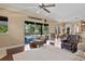Living room with pool view, sliding glass doors, and hardwood floors at 1912 Westover Reserve Blvd, Windermere, FL 34786