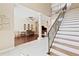 Bright living room featuring soaring ceilings, hardwood floors, and a grand staircase at 1912 Westover Reserve Blvd, Windermere, FL 34786