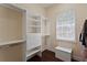 Organized walk-in closet with built-in shelving, drawers, and hanging rods at 1912 Westover Reserve Blvd, Windermere, FL 34786