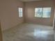 Bright bedroom featuring light walls and wood-look flooring at 17353 Chateau Pine Way, Clermont, FL 34711
