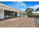 View of the porch featuring wood flooring, a glass railing, and backyard view at 2161 Sharon Rd, Winter Park, FL 32789