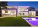 Night view showcasing the modern design, outdoor kitchen, and a pristine pool, perfect for luxurious living at 2161 Sharon Rd, Winter Park, FL 32789