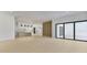Expansive living room with wood flooring, and access to the outdoor patio at 2161 Sharon Rd, Winter Park, FL 32789