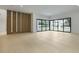 Spacious living room with modern flooring, large windows and seamless access to the outdoors at 2161 Sharon Rd, Winter Park, FL 32789