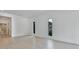 Bright living room features modern flooring, large windows and bathroom view at 2161 Sharon Rd, Winter Park, FL 32789