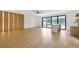 Bright living room with a ceiling fan, hardwood floors, and large sliding glass doors at 2161 Sharon Rd, Winter Park, FL 32789
