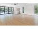 Spacious living room features hardwood floors, bar area, and large sliding doors to backyard at 2161 Sharon Rd, Winter Park, FL 32789
