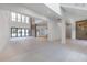 Bright living area with soaring ceilings, large windows, and modern tile flooring at 2161 Sharon Rd, Winter Park, FL 32789