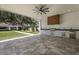 Covered outdoor kitchen with stainless steel grill, countertop space, ample cabinet storage, and open access to backyard at 2161 Sharon Rd, Winter Park, FL 32789