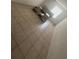 Bedroom featuring neutral tile floor, light walls, bright window, and bedframe at 4008 Versailles Dr # 4008C, Orlando, FL 32808