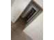 Hallway features durable tile flooring and leads to the bedroom closet at 4008 Versailles Dr # 4008C, Orlando, FL 32808