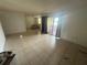 Spacious living room with tile flooring and access to patio at 4008 Versailles Dr # 4008C, Orlando, FL 32808