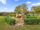 Neighborhood playground with mature landscaping and lush green grass at 4008 Versailles Dr # 4008C, Orlando, FL 32808