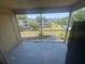 Screened balcony overlooking a well-maintained green space and neighboring condo buildings at 4121 Dijon Dr # 4121H, Orlando, FL 32808