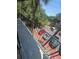 A red car is parked in the parking lot viewable from the balcony at 4121 Dijon Dr # 4121H, Orlando, FL 32808