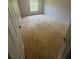 This bedroom features a window, blank walls and plywood flooring at 4121 Dijon Dr # 4121H, Orlando, FL 32808