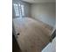 This bedroom features French doors to the outside and plywood flooring at 4121 Dijon Dr # 4121H, Orlando, FL 32808