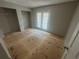 Bright bedroom with closet space, access to outdoor balcony, and fresh flooring at 4121 Dijon Dr # 4121H, Orlando, FL 32808