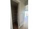 In-unit storage closet with shelving, offering convenient organizational opportunities near the living space at 4121 Dijon Dr # 4121H, Orlando, FL 32808