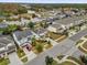 Aerial shot showcases neighborhood homes, pools, and conservation area in the distance at 4501 Monado Dr, Kissimmee, FL 34746