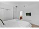 Bedroom featuring a walk-in closet, attached bathroom, and mounted television at 4501 Monado Dr, Kissimmee, FL 34746
