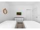 This neutrally decorated bedroom features two twin beds, a dresser, and fun lion-themed decor at 4501 Monado Dr, Kissimmee, FL 34746