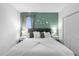 Relaxing bedroom with a large bed, neutral decor, and an attractive green accent wall at 4501 Monado Dr, Kissimmee, FL 34746
