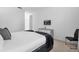 Bright bedroom featuring a queen bed with stylish gray accents and a wall-mounted TV at 4501 Monado Dr, Kissimmee, FL 34746