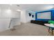 Upstairs bonus room featuring a entertainment area with tv and themed design at 4501 Monado Dr, Kissimmee, FL 34746
