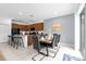 Dining room showcases stylish seating, modern lighting, and a view of outdoor living at 4501 Monado Dr, Kissimmee, FL 34746