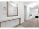 Welcoming entryway featuring neutral colors, modern mirror, and a view to the backyard at 4501 Monado Dr, Kissimmee, FL 34746