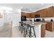 Open kitchen with granite countertops and bar seating, perfect for entertaining guests at 4501 Monado Dr, Kissimmee, FL 34746