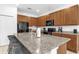Bright kitchen features granite countertops, a center island with seating, and ample cabinet space at 4501 Monado Dr, Kissimmee, FL 34746