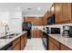 Spacious kitchen with granite countertops, stainless steel appliances, and abundant cabinet space for storage at 4501 Monado Dr, Kissimmee, FL 34746
