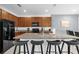 Modern kitchen featuring granite countertops, stainless steel appliances, and a center island with seating at 4501 Monado Dr, Kissimmee, FL 34746