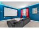 Home theater featuring a large projection screen, comfortable seating, and dimmed lighting for an immersive experience at 4501 Monado Dr, Kissimmee, FL 34746