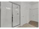 Modern bathroom featuring a glass-enclosed shower with white tiled walls at 4571 Cabello Loop, Kissimmee, FL 34746
