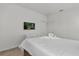 Bright bedroom featuring a queen-size bed, white walls, and a carpeted floor at 4571 Cabello Loop, Kissimmee, FL 34746