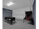 Spacious garage featuring a pool table and basketball game, perfect for entertainment and recreation at 4571 Cabello Loop, Kissimmee, FL 34746