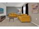 Cozy living room featuring comfortable sofas, neutral walls, and a carpeted floor at 4571 Cabello Loop, Kissimmee, FL 34746